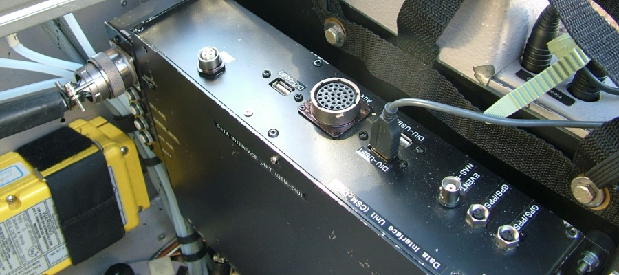 the data interface unit mounted to the rear of the cockpit seating